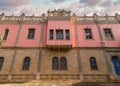 Warm sunset light bathes Prince Naguib Palace in soft glow, highlighting the intricate Mamluk Architecture, Cairo, Egypt