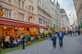 Warm sunset over busy with tourists famous Graben shopping and restaurant street near Stephans square Stephansplatz in