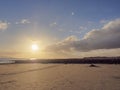 Warm sunset over a empty sandy beach, Cloudy blue sky, Nobody Royalty Free Stock Photo