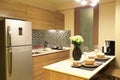 Warm tone of luxury interiors design of the kitchen in condominium, as kitchen design background.