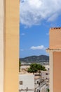 Vertical glimpse into Eivissa Mediterranean architecture under clear blue skies Royalty Free Stock Photo