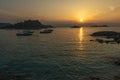 Warm tropical sunrise, sunset with boats waiting for tourists