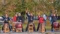 Warm up before the marathon. A group of drummers plays rhythmic music for the runners. Recreational sports activities for people