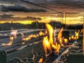 A warm welcome fire burning on a gas heater at sunset Royalty Free Stock Photo