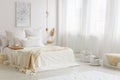 Beige blanket on white bed