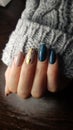 Warm winter manicure design with sweater sleeve