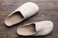 Warm winter women woolen slippers on the floor. Copy space for text