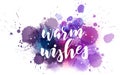 Warm wishes holiday calligraphy on watercolor paint splash