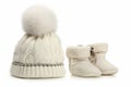 Warm woolen baby hat and booties over white Royalty Free Stock Photo