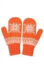 Warm woolen knitted mittens isolated on white background. Orange