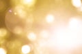 Warm yellow gold color of blurred sky background with nature glowing sun light flare and bokeh Royalty Free Stock Photo