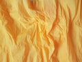 Warm yellow wrinkled paper background blank surface