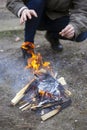 Warm your hands by the fire. the guy is trying to get rid of the cold with flame Royalty Free Stock Photo