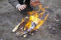 Warm your hands by the fire. the guy is trying to get rid of the cold with flame Royalty Free Stock Photo
