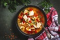 Warming autumn soup with red lentils, chicken fillet, vegetables, spices and paprika, comfort food. Green table, top view Royalty Free Stock Photo