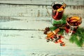 A warming composition, two glasses of mulled wine with fruits and spices, surrounded by fir cones and branches on a wooden table Royalty Free Stock Photo