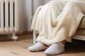 Warming Feet on White Radiator, Man Warms his Feet at Home, Cold Winter, Expensive Electricity Saving Concept