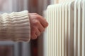 Warming Hands on White Radiator, Man Warms his Hand at Home, Cold Winter, Expensive Electricity Saving Concept,