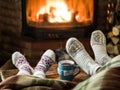 Warming and relaxing near fireplace with a cup of hot drink. Royalty Free Stock Photo