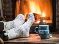 Warming and relaxing near fireplace with a cup of hot drink Royalty Free Stock Photo