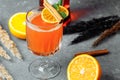 Warming winter cocktail with aperol. Hot aperol. Cocktail For New Years and Christmas. Christmas winter cocktail with aperol