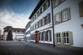 Warmly dressed people walk on cathedral square of Basel