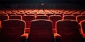 Warmly Lit Red Velvet Seats in an Intimate Movie Theater Setting. Close up view of Red Seats in Rows. Front View Royalty Free Stock Photo