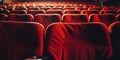 Warmly Lit Red Velvet Seats in an Intimate Movie Theater Setting. Close up view of Red Seats in Rows. Front View Royalty Free Stock Photo