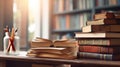 Warmly lit study scene with a stack of hardcover books and an open book on a wooden table, alongside a jar of colorful pencils