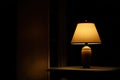 Warm Glow of a Table Lamp in a Dark Room Royalty Free Stock Photo