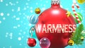 Warmness and Xmas holidays, pictured as abstract Christmas ornament ball with word Warmness to symbolize the connection and Royalty Free Stock Photo