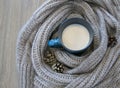 Warmth and comfort in a hot cup and a knitted scarf Royalty Free Stock Photo