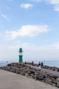 WARNEMUNDE, GERMANY - CIRCA 2016: A green lighthouse guides ships to this popular German holiday port town on the Baltic Sea
