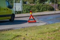 Warning accident sign placed on urban roadside.. Royalty Free Stock Photo
