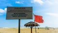 The warning board for the tourist that come to the Batu Burok Beach to swim at their own risk Royalty Free Stock Photo