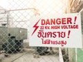 Warning danger high voltage sign and thai language mean danger h Royalty Free Stock Photo
