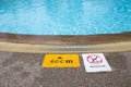 Warning and depth sign at swimming pool for children Royalty Free Stock Photo