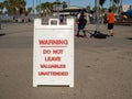 Warning do not leave items unattended theft prevention sign at public park Royalty Free Stock Photo