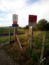warning and information signs by manually operated railway level crossing in the UK