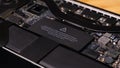 Warning label on Macbook Pro motherboard - close up diagonal shot