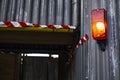 Warning light on corrugated iron sheeting outside construction site Royalty Free Stock Photo