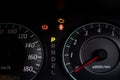 The warning lights of car engine check, door opened, parked and hand break in the speedometer of a vehicle Royalty Free Stock Photo
