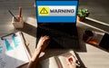 Warning message sign on screen. Virus detection security breathe hardware or software trouble. Royalty Free Stock Photo