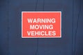 Warning moving vehicles sign at construction site