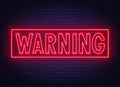 Warning neon sign on dark background .