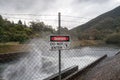 Warning No Entry sign on chicken wire fence Royalty Free Stock Photo