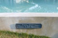 Warning pool depth sign by swimming pool Royalty Free Stock Photo