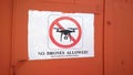 Warning about the prohibition of flights without a special permit on quadrocopters and drones in the center of Oia in Santorini