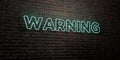 WARNING -Realistic Neon Sign on Brick Wall background - 3D rendered royalty free stock image