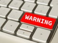 Warning on Red button of a keyboard Royalty Free Stock Photo